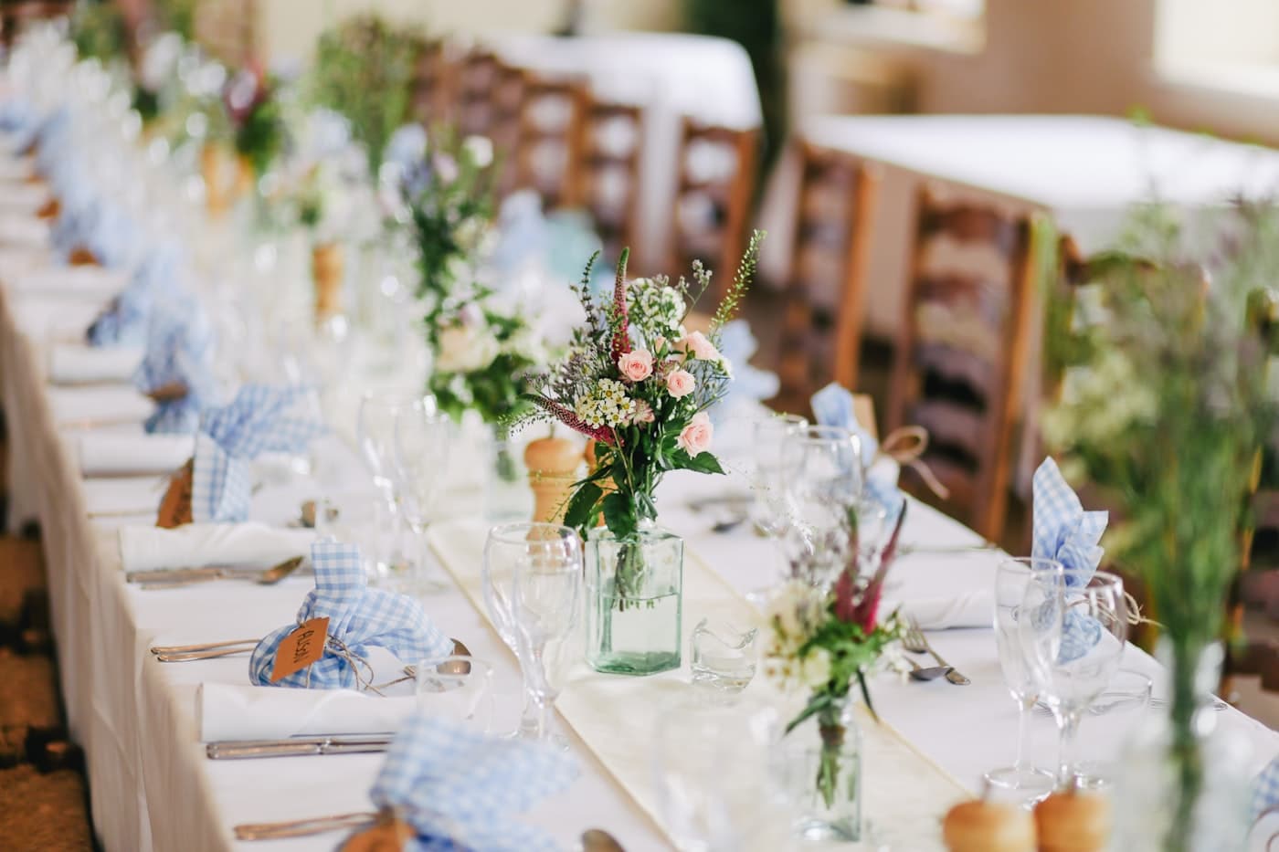 An elegant wedding reception table set for guests